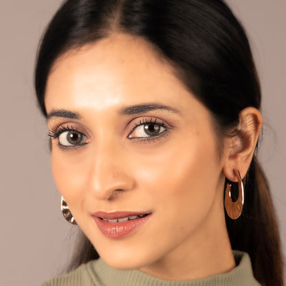 Oval shaped golden hoops